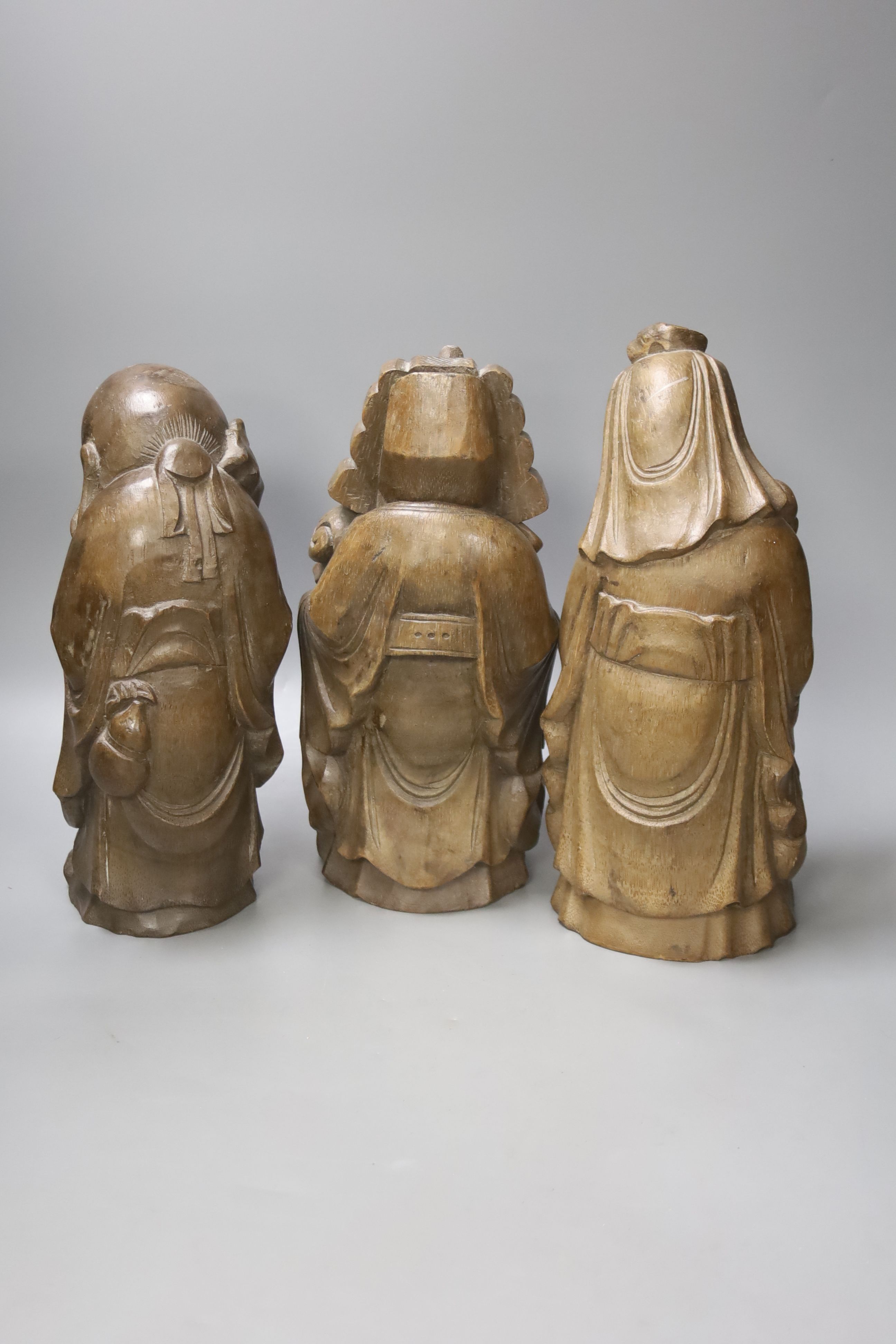 Three Chinese carved bamboo figures of the three star gods